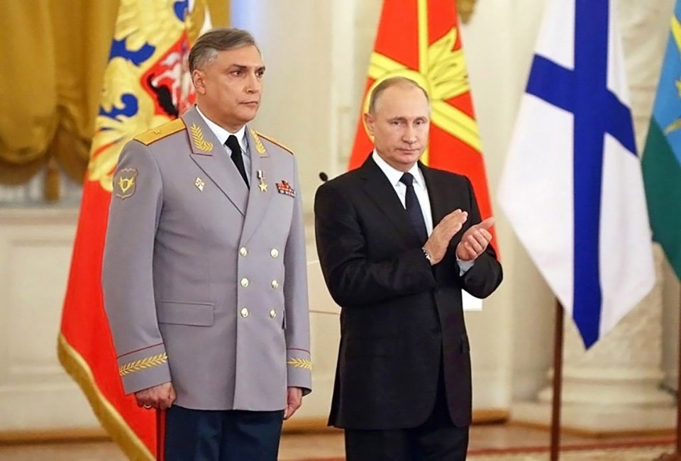 The commander has a number of military honours to his name and is pictured here alongside Putin