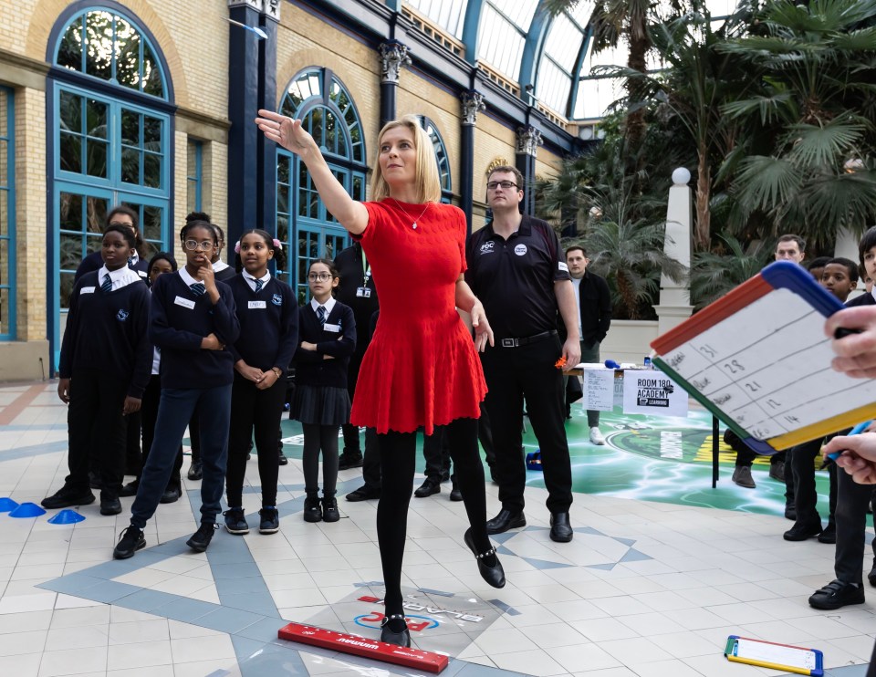 Rachel Riley throws a few arrows at Ally Pally in London during the World Darts Championship