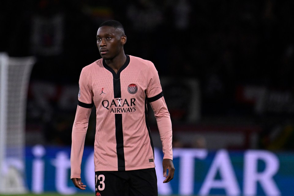 Randal Kolo Muani of Paris Saint-Germain in a pink jersey.