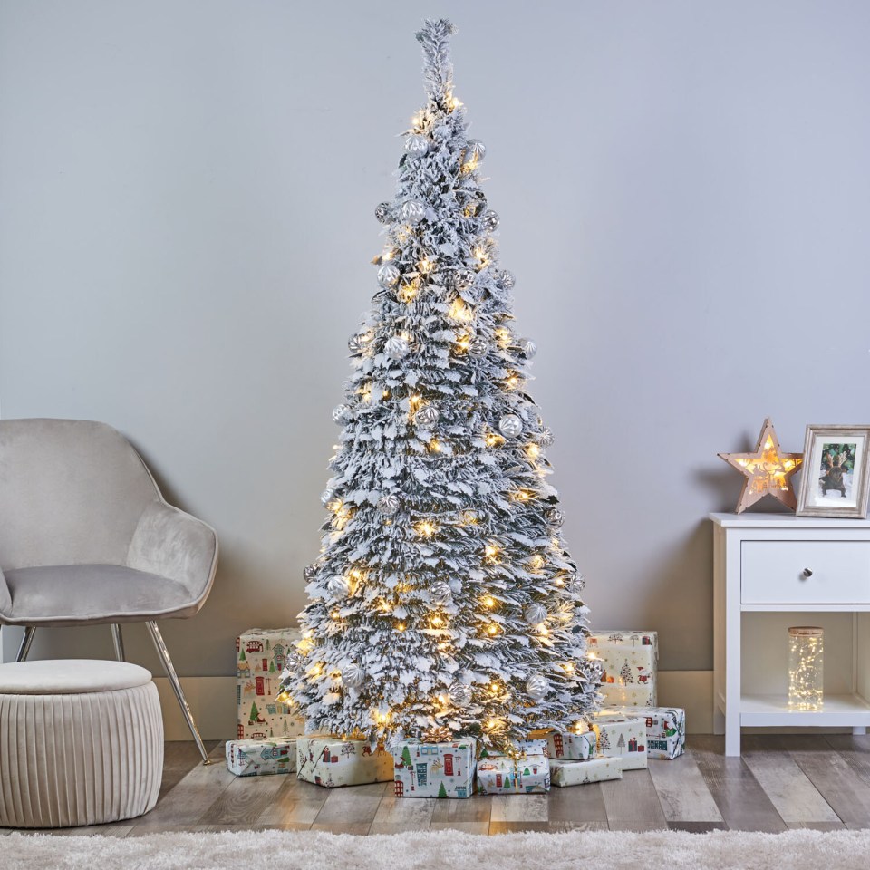 The flocked 6ft tree is currently £99.99