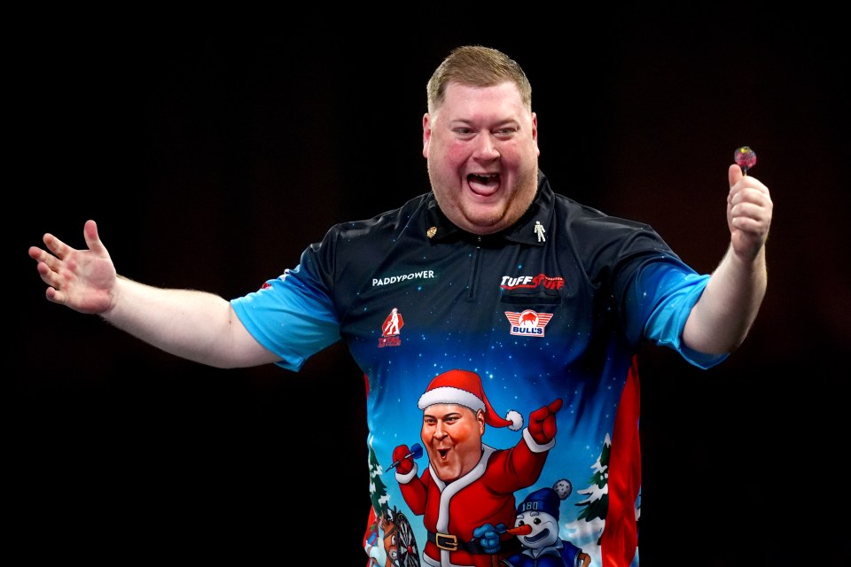 Ricky Evans celebrates a victory at the World Darts Championship.