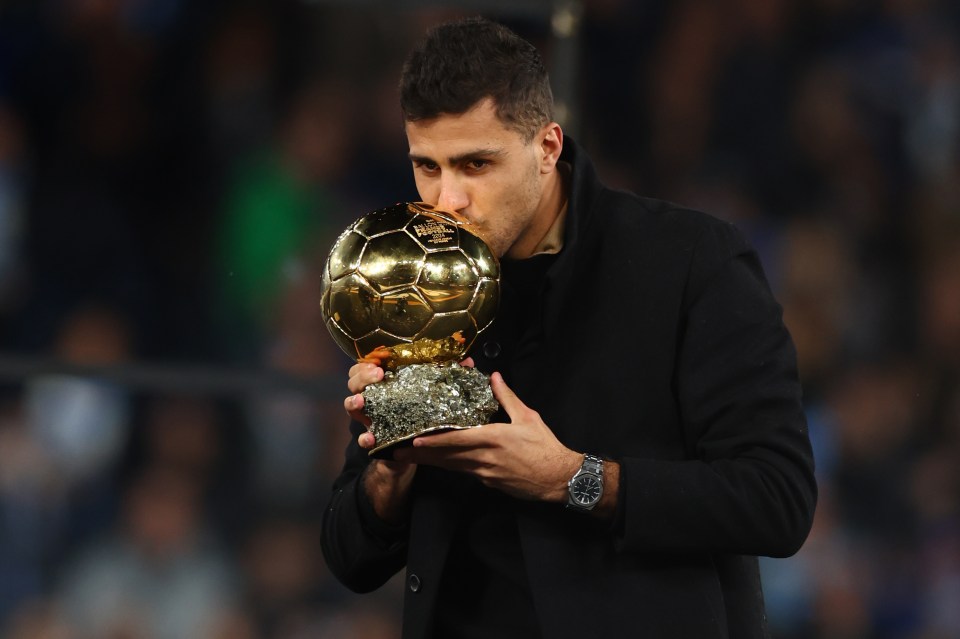 Rodri of Manchester City holding the Ballon d'Or.