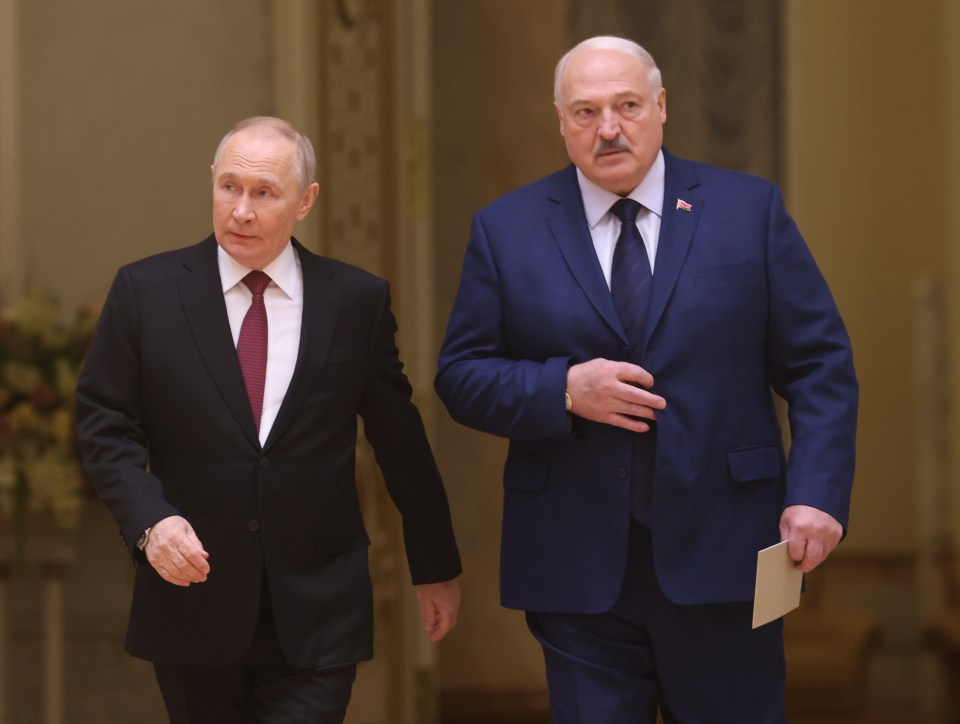 Russian President Vladimir Putin and Belarusian President Alexander Lukashenko enter the hall during the Supreme Council of Russia and Belarus on December 6, 2024