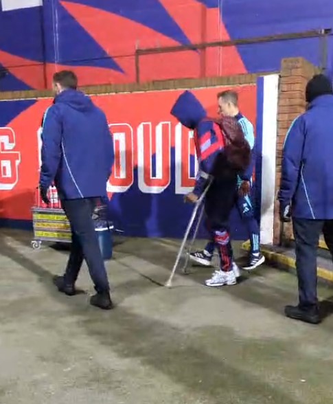 Saka on crutches after a game.