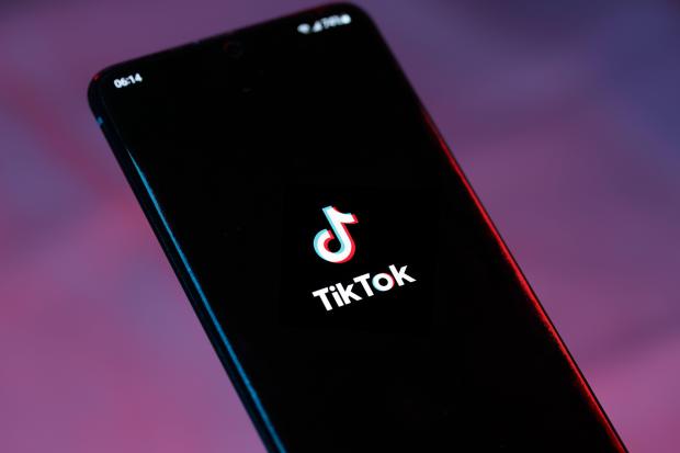 TikTok logo on a smartphone screen.