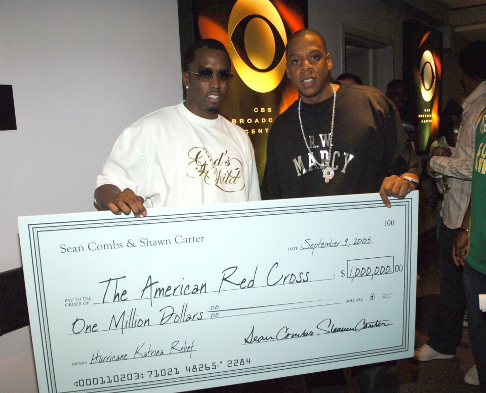 American Red Cross logo, one million dollars in text, Sean "Diddy" Combs and Jay-Z in the background.