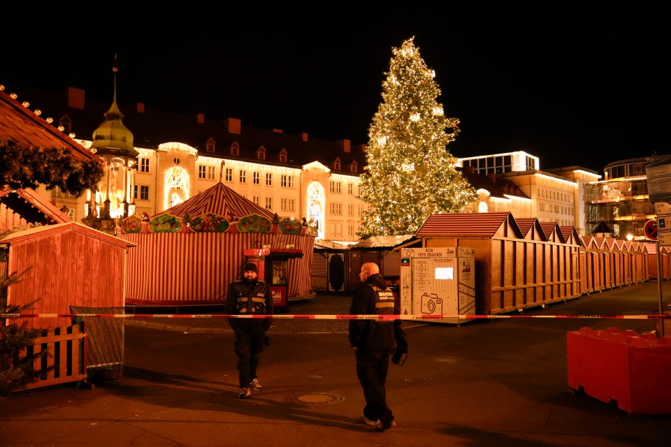 Security guards at a cordoned-off Christmas market.