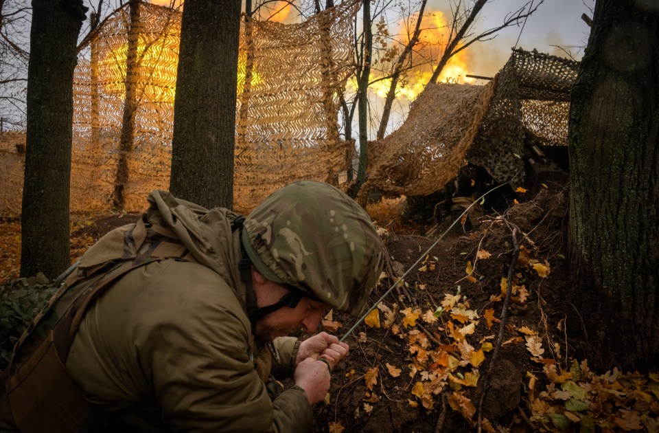 A Ukrainian soldier fires towards Russian positions near Kharkiv, Ukraine, in November 2024