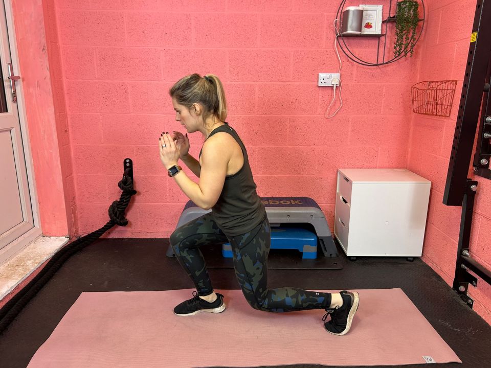 Woman performing a lunge exercise.