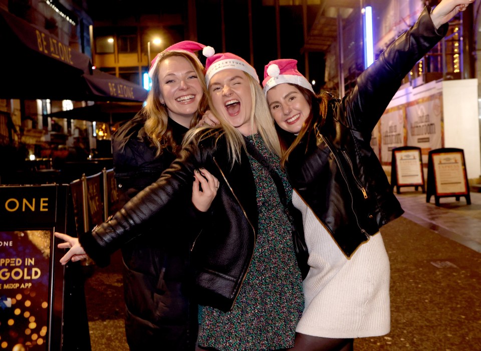 Three pals don Christmas hats in Leeds