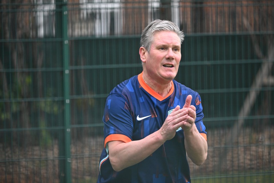 Keir Starmer playing football in a Dutch football shirt.