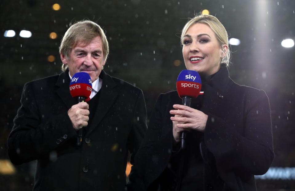 Sir Kenny Dalglish and Kelly Cates, Sky Sports presenters, at a Premier League match.