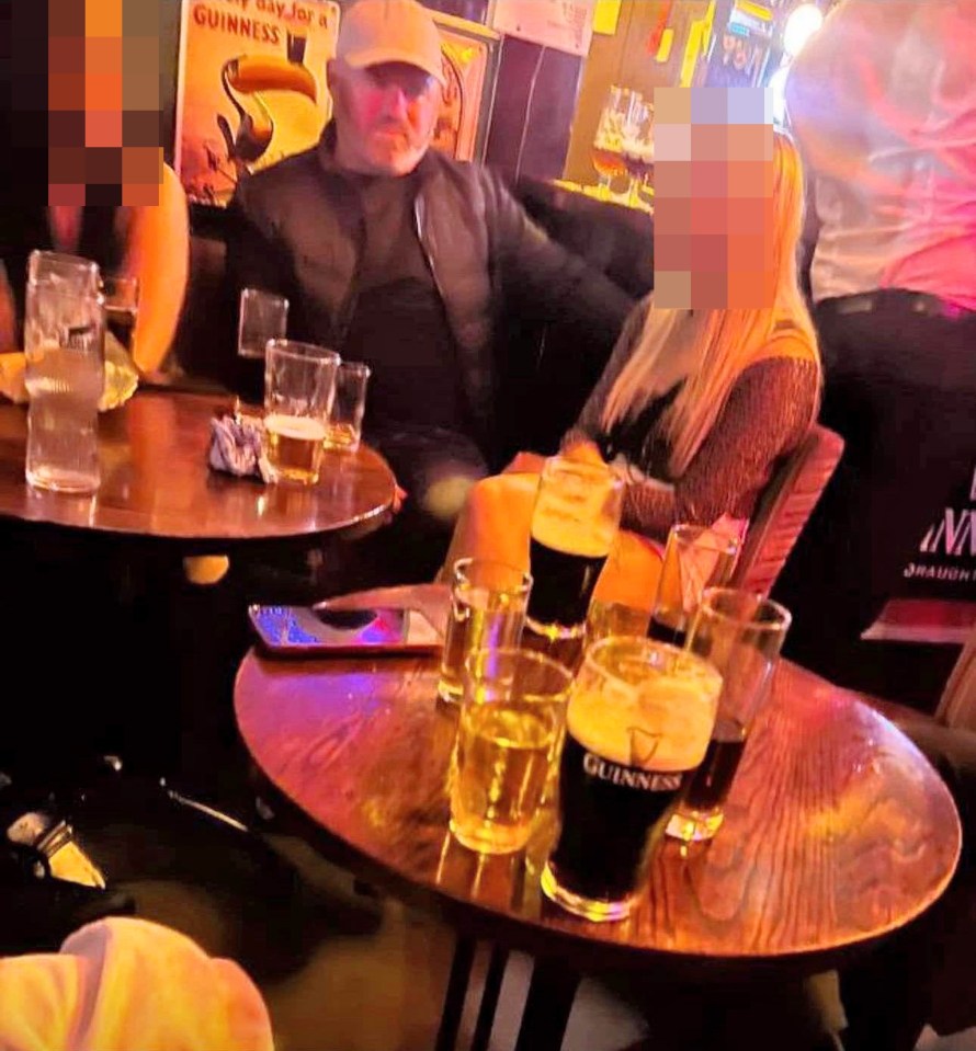 And another image of him sitting with two women in the pub was taken on a night out back in August