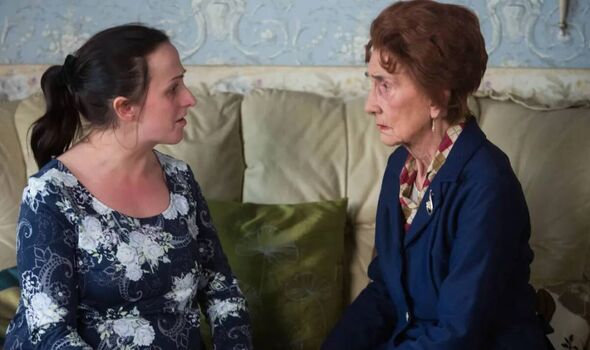 Two women having a serious conversation.