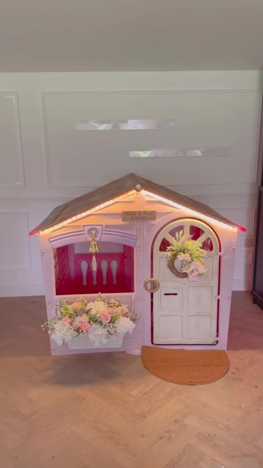 Decorated children's playhouse with lights.