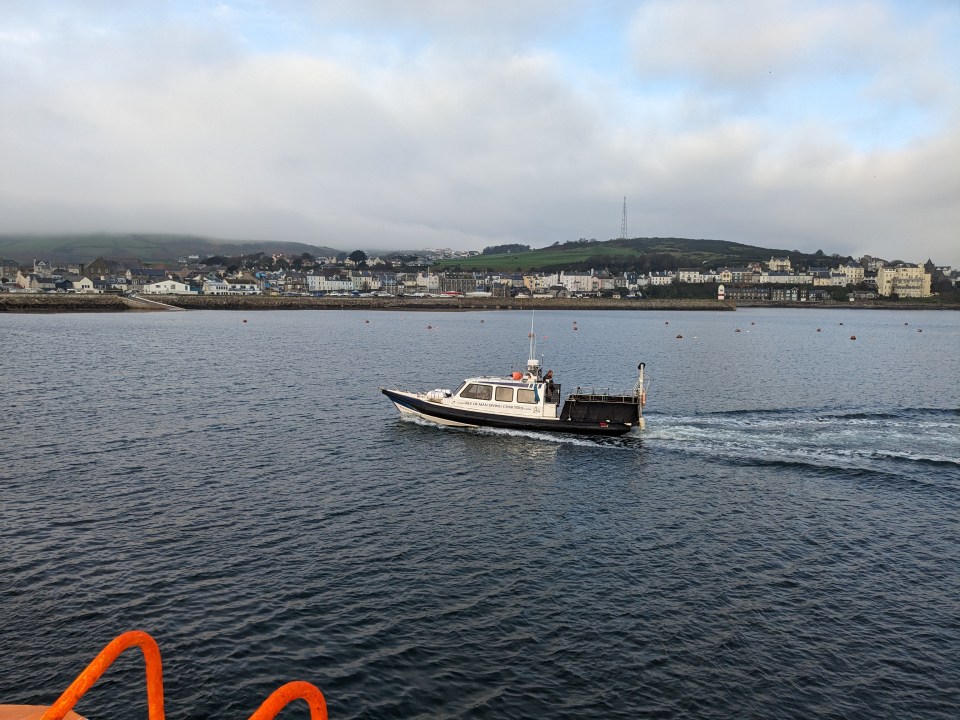 Boat traveling near Calf of Man.