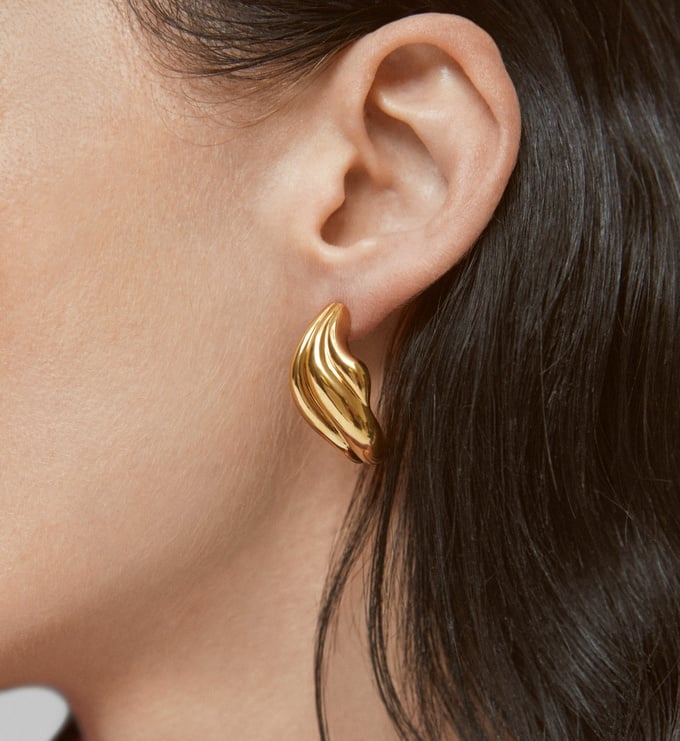 Gold swirl earrings.