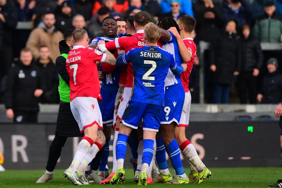 Players in a heated confrontation after a soccer game.