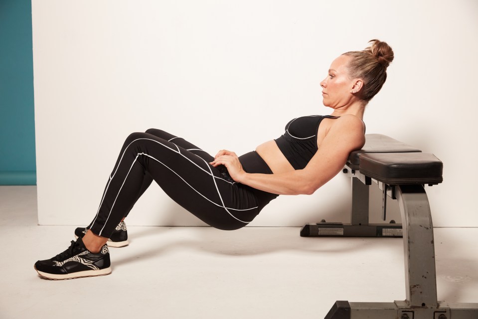 Place your back against the bench and bend your knees at 90 degrees, with feet flat on the floor