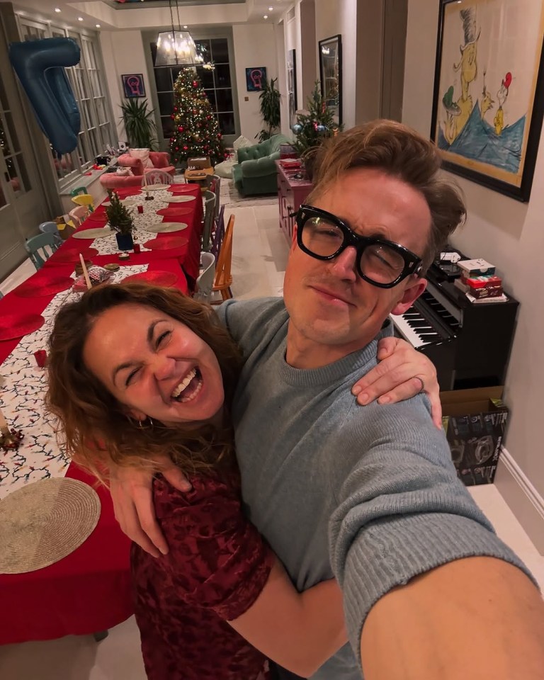 Tom and Giovanna Fletcher hugging on Christmas Day.