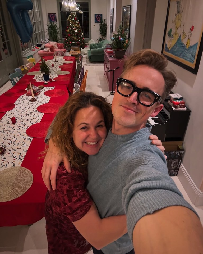 Tom and Giovanna Fletcher hugging on Christmas Day.