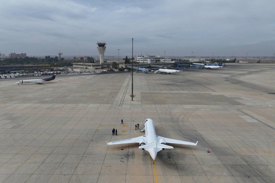 United Nations airplane on an airport tarmac.