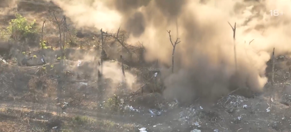 Plumes of smoke can be seen rising from the battlefield as the Ukrainian engages with the Russian soldiers