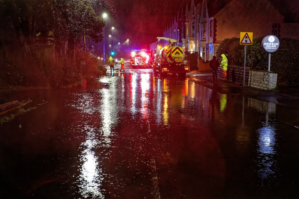 Emergency services responding to flooding at night.