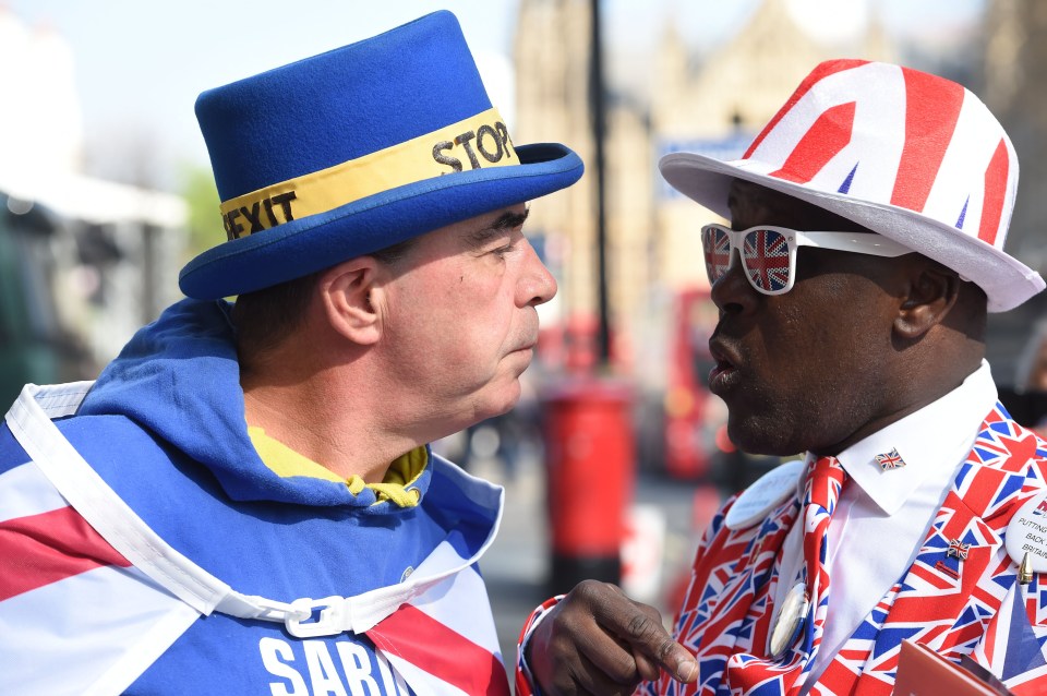 Two Brexit demonstrators face each other; one wears a blue hat with "Stop Brexit" and the other a Union Jack hat and sunglasses.