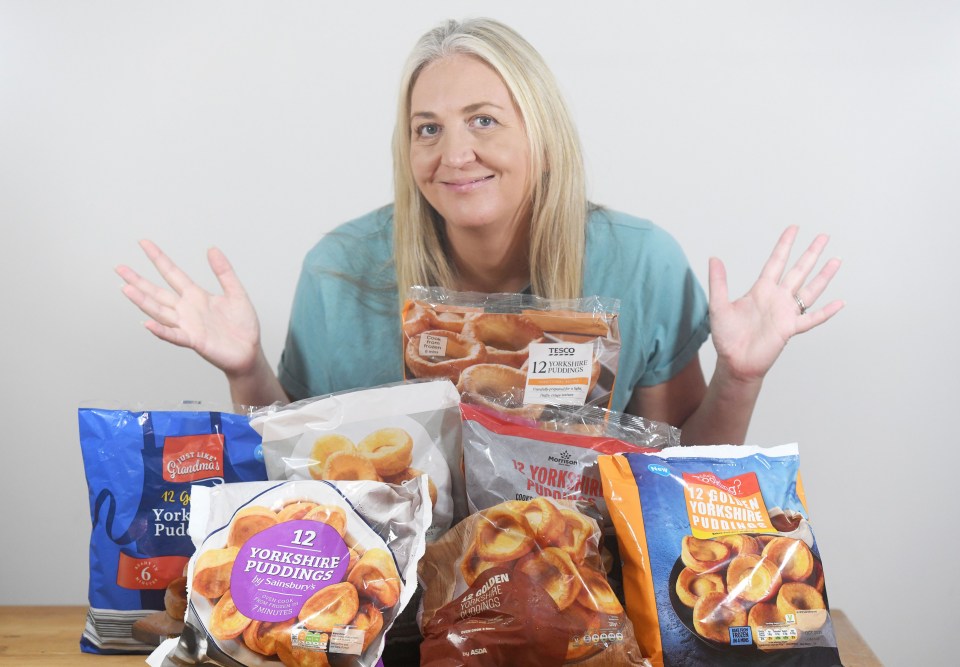 Woman holding various brands of frozen Yorkshire puddings.