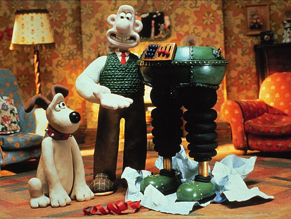 Wallace and Gromit with a robot in trousers.