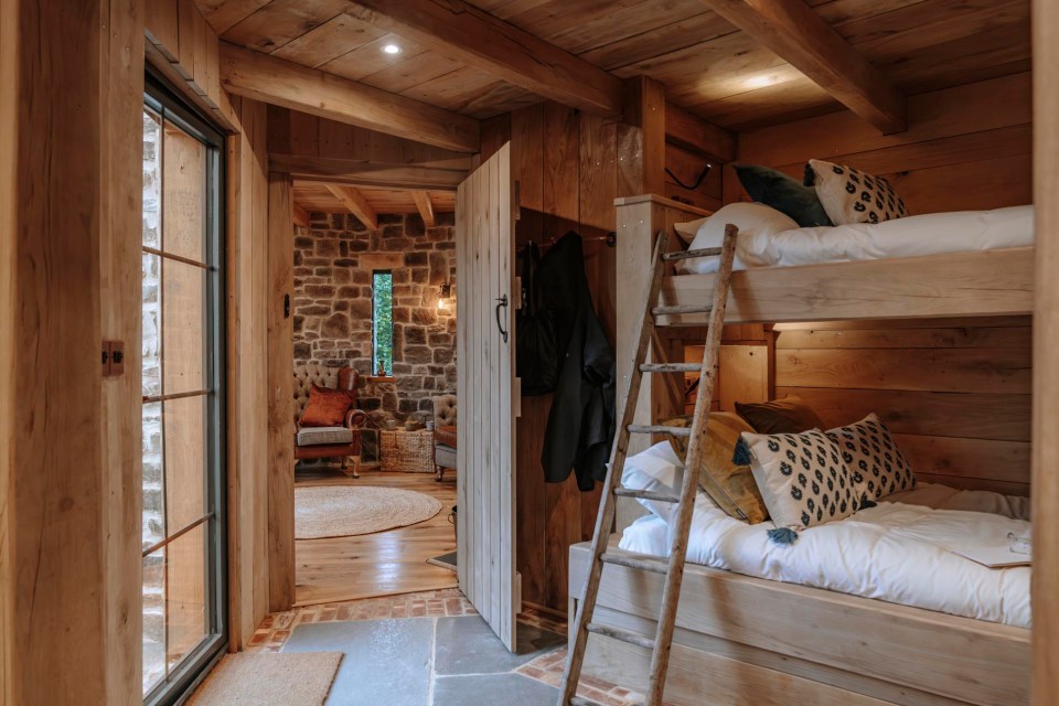 Wooden bunk beds in a rustic room.