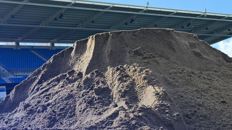 Large pile of sand in a stadium.