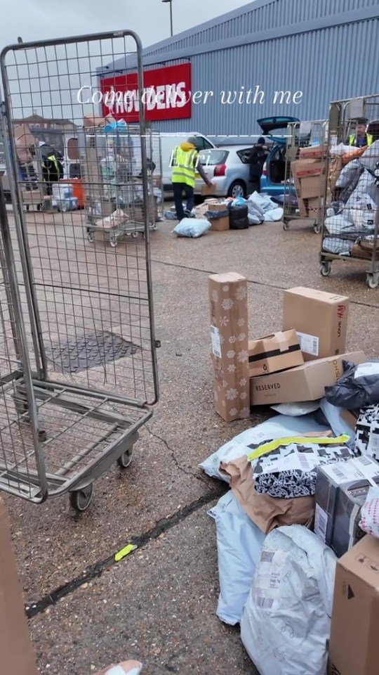 Packages piled on the ground outside a Howdens distribution center.