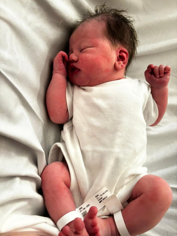 Newborn baby sleeping in a hospital.