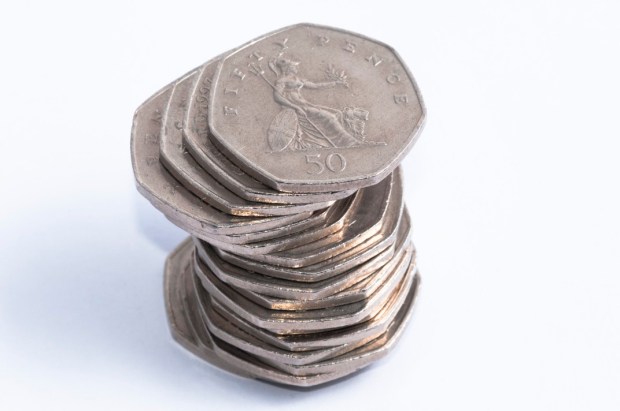 Stack of fifty pence coins.