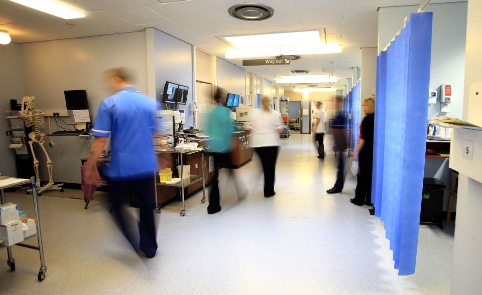 Blurred photo of NHS hospital ward staff.