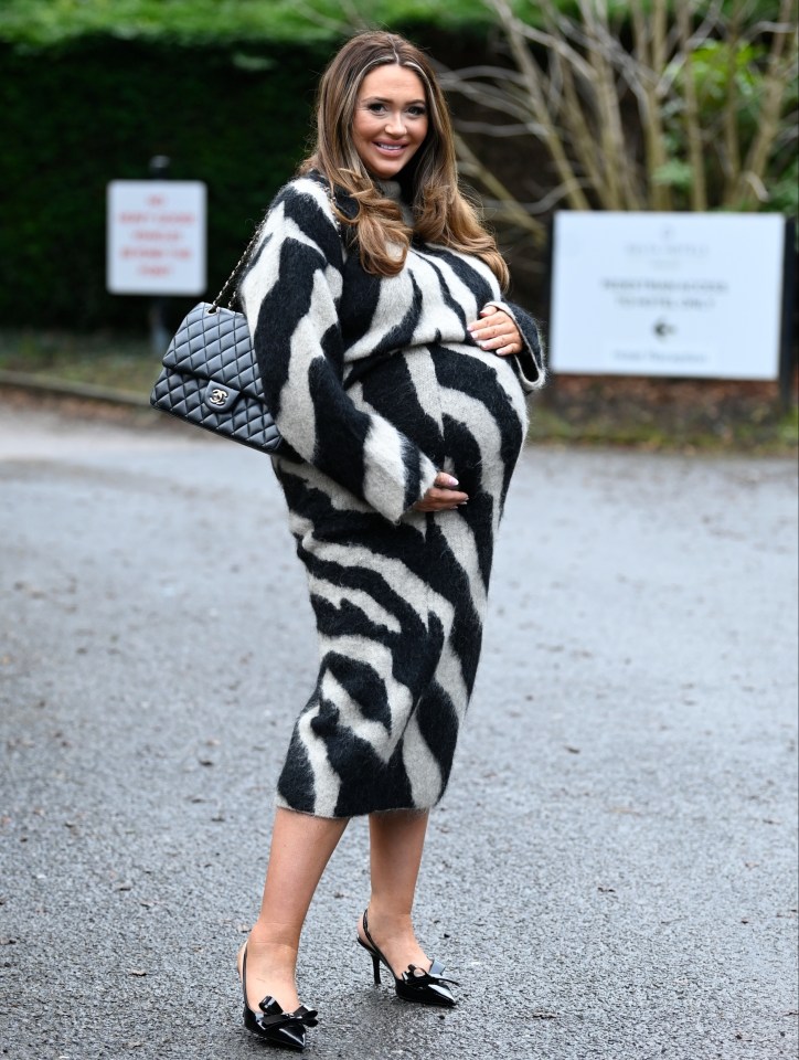 Pregnant woman in zebra-print dress.