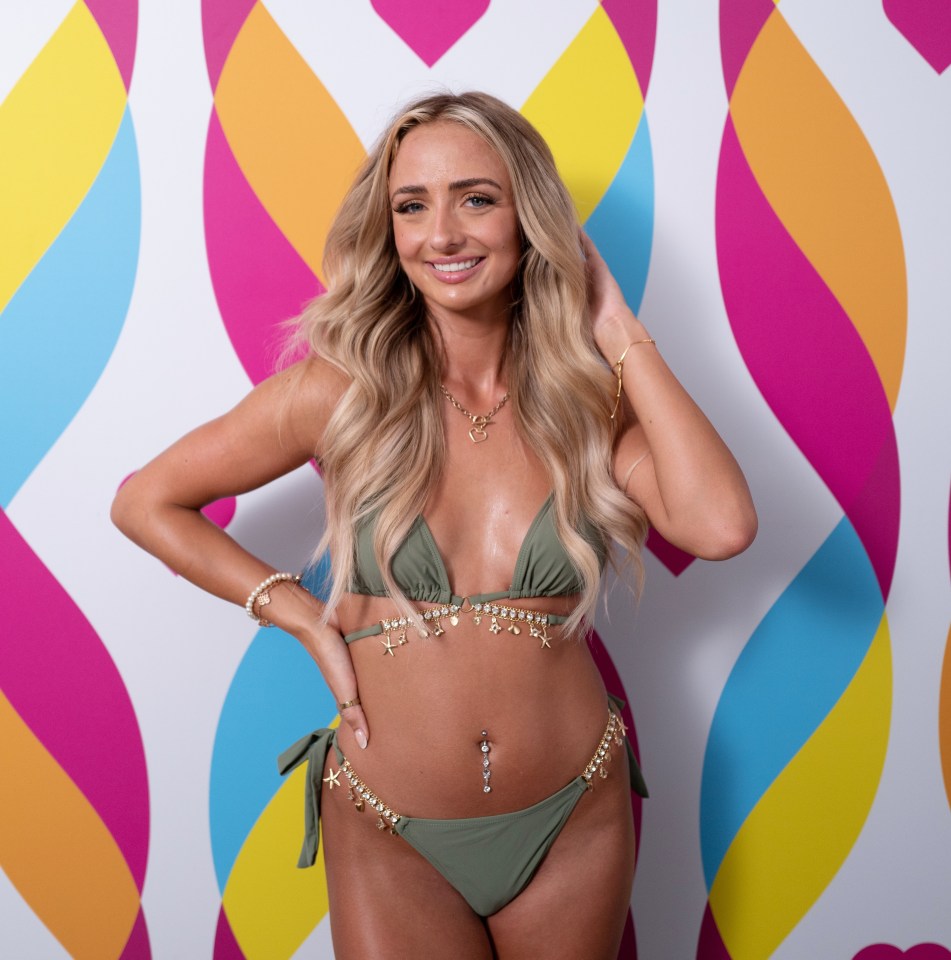 Abi Moores in a green bikini on the Love Island set.