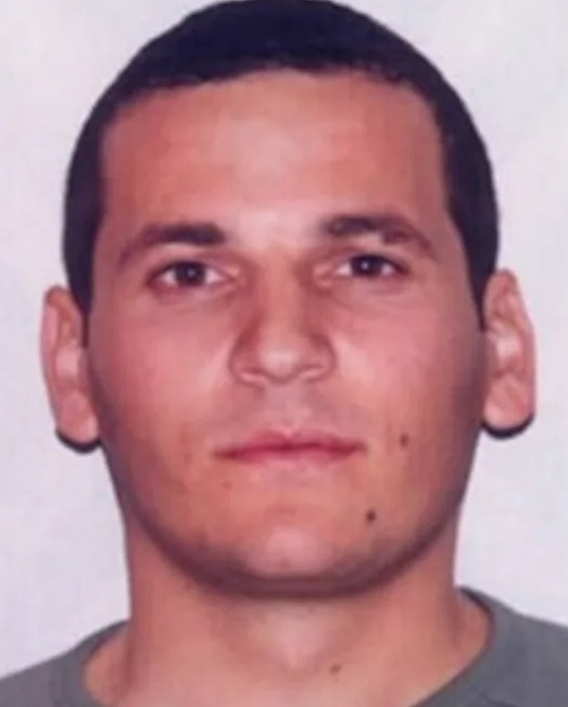 Mugshot and wanted poster for Dritan (Gramos) Rexhepi, convicted of murder.