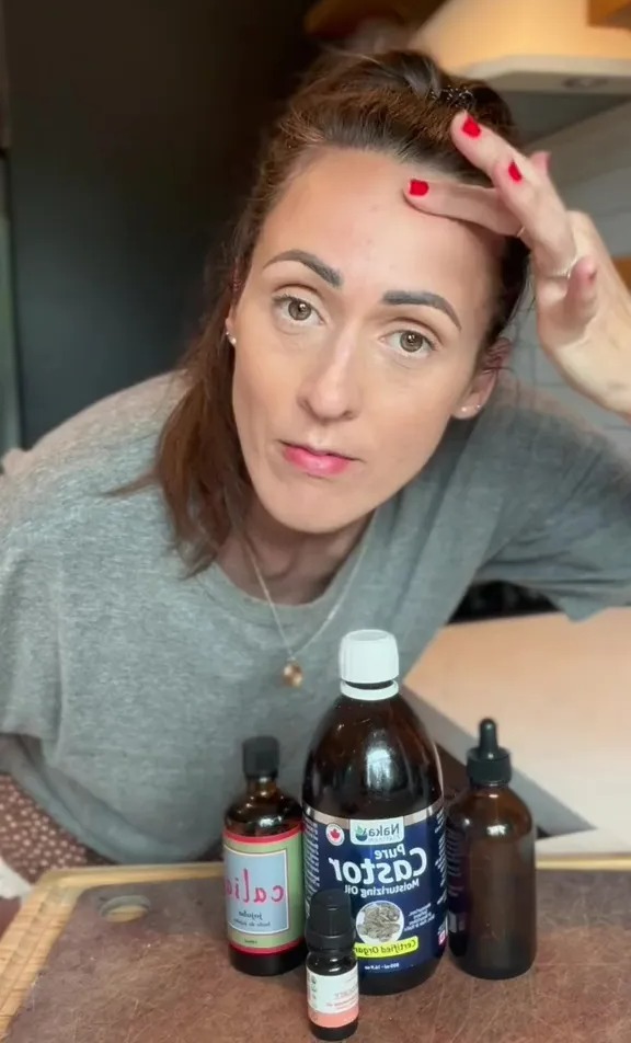 Woman demonstrating DIY Botox using oils.