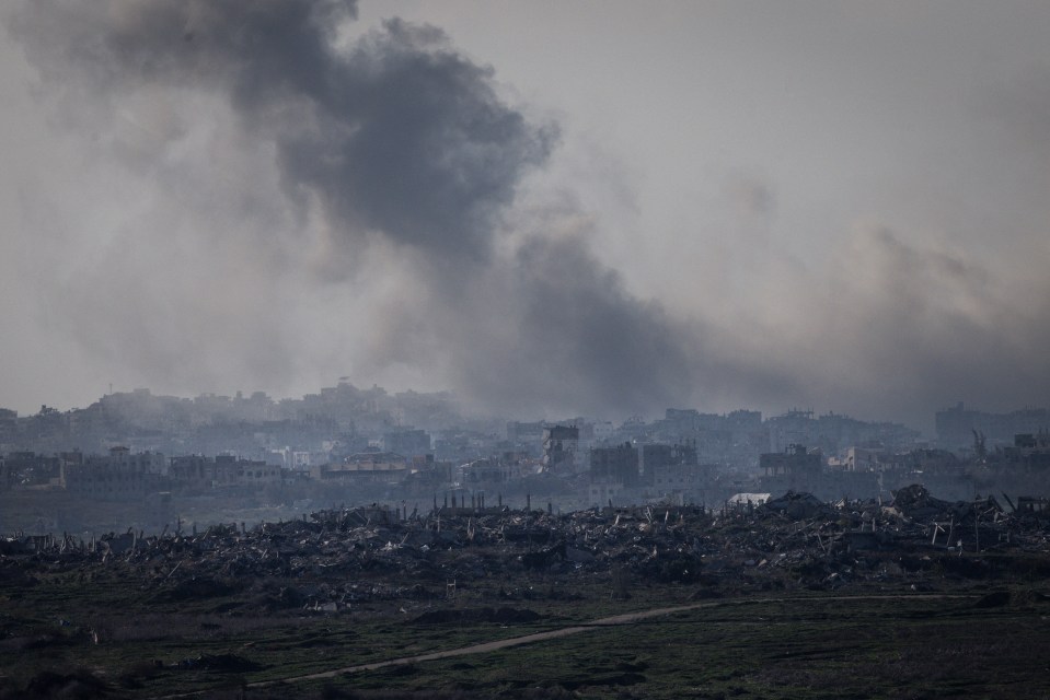 Smoke rises from destroyed buildings in the northern Gaza Strip.