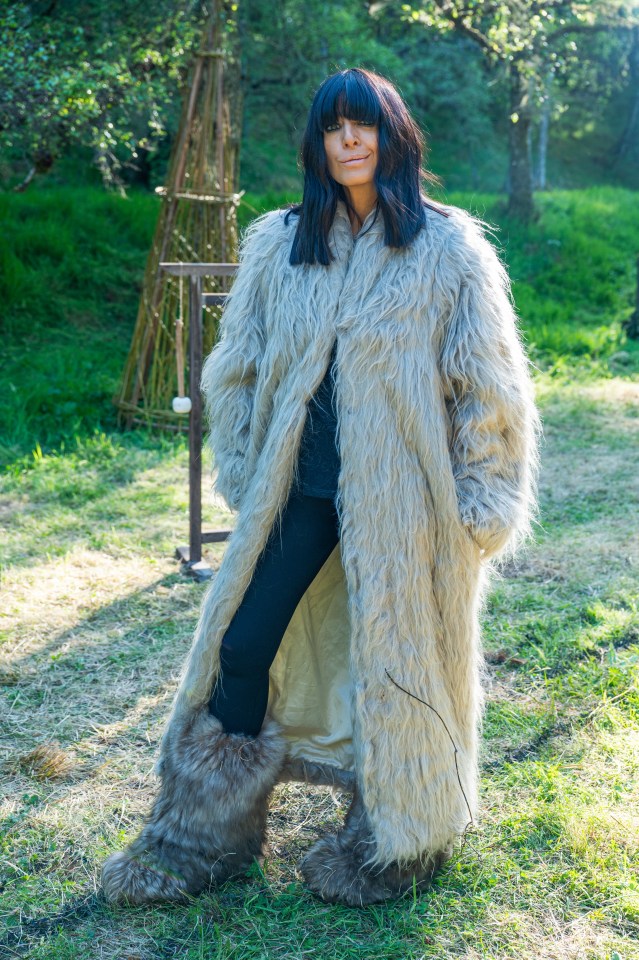 Claudia Winkleman in a fluffy coat and furry boots.