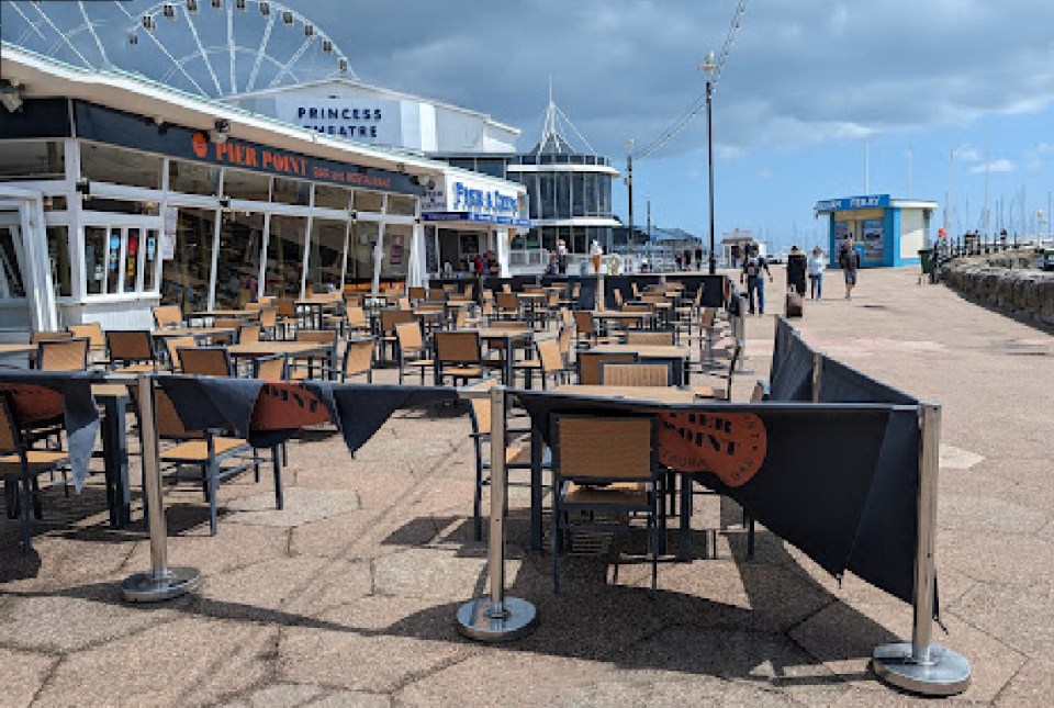 Outdoor seating area at Pier Point Bar & Restaurant in Torquay.