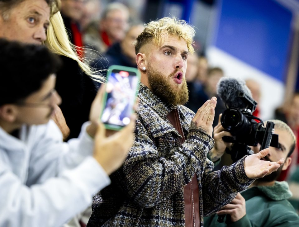 Jake Paul watching a women's 1000-meter sprint.