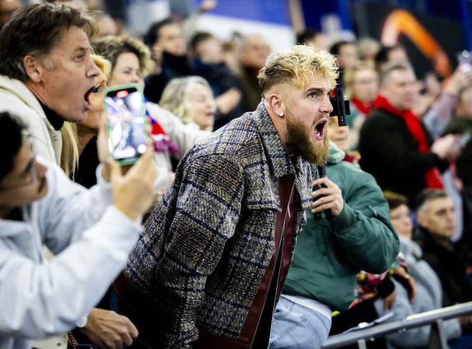 Jake Paul cheering at a women's 1000-meter sprint.