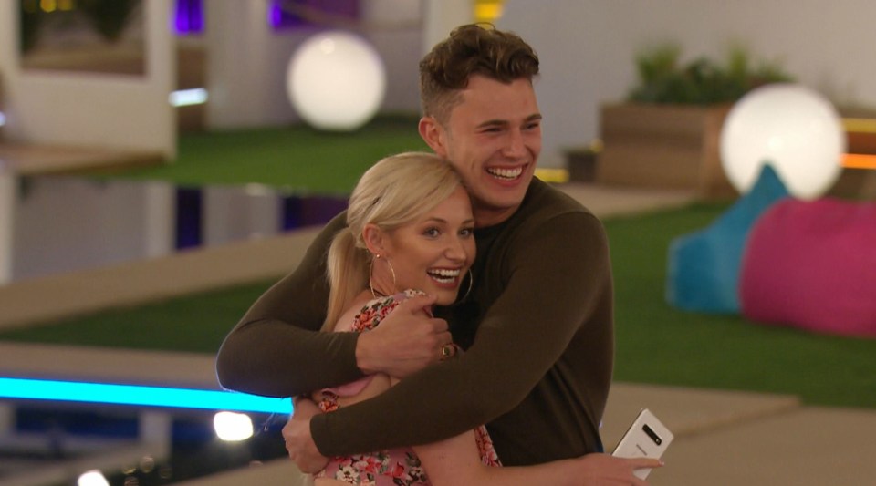 Amy Hart and Curtis Pritchard hugging on Love Island.