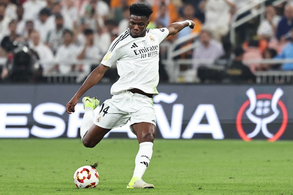 Aurelien Tchouameni taking a shot during a soccer game.