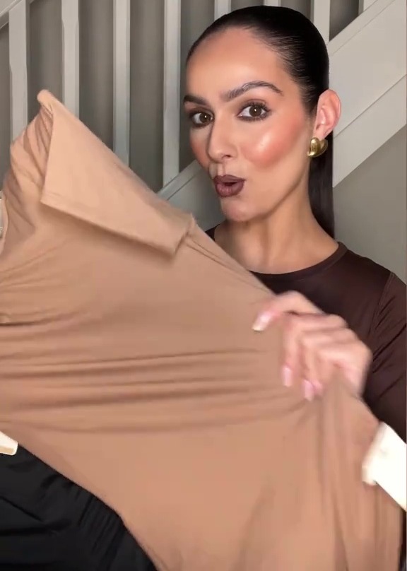 Woman showing off a nude-colored fabric.