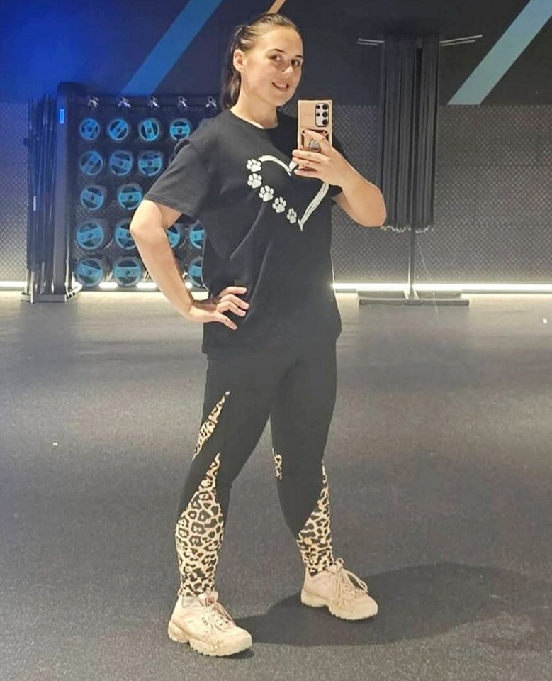 Woman in a gym taking a selfie.